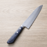 增谷訓生 牛刀 180mm VG10鋼<br>鎚目大馬士革 刻流藍柄
