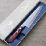 增谷訓生 牛刀 180mm VG10鋼<br>鎚目大馬士革 雪華 紅柄